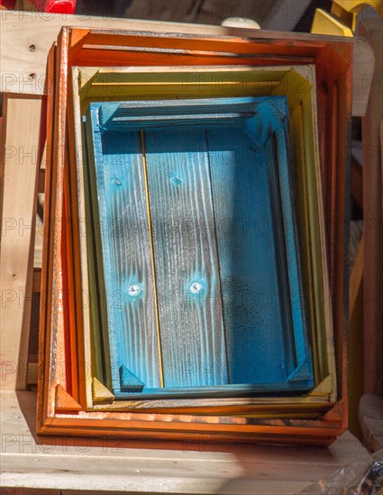 Colorful wooden crate boxes for sale in a market