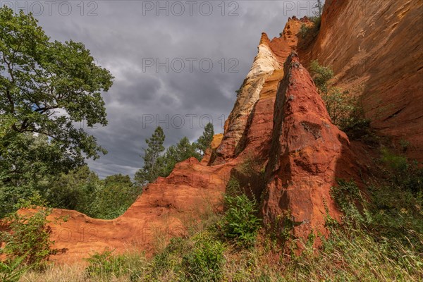 Red ocher cliff in the Luberon in Provence. Roussilon, Vaucluse, France, Europe