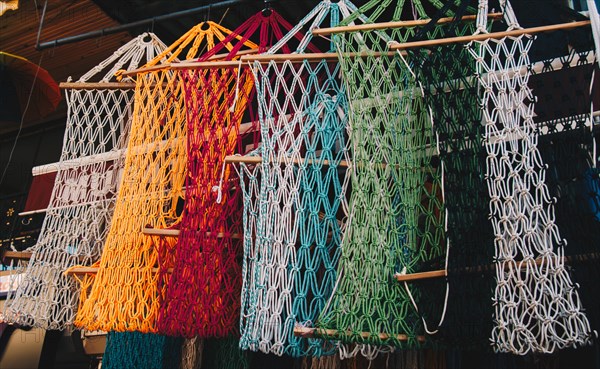 Empty mesh bags of various color at a market place