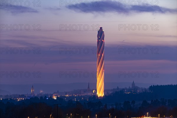 Test tower of TK-Elevator in the early morning. Express and high-speed lifts are tested in the 246-metre-high tower. Behind it, the city with its historic towers and churches. Rottweil, Baden-Wuerttemberg, Germany, Europe