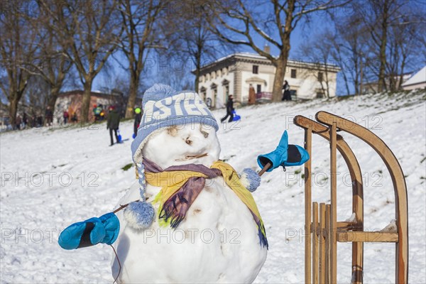 Snowman with sledge, cap and scarf, Bremen, Germany, Europe