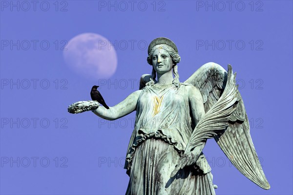 Jubilee column on the Schlossplatz with the sculpture of the goddess Concordia, she is the personification of concord in Roman mythology, Moon, Stuttgart, Baden-Wuerttemberg, Germany, Europe