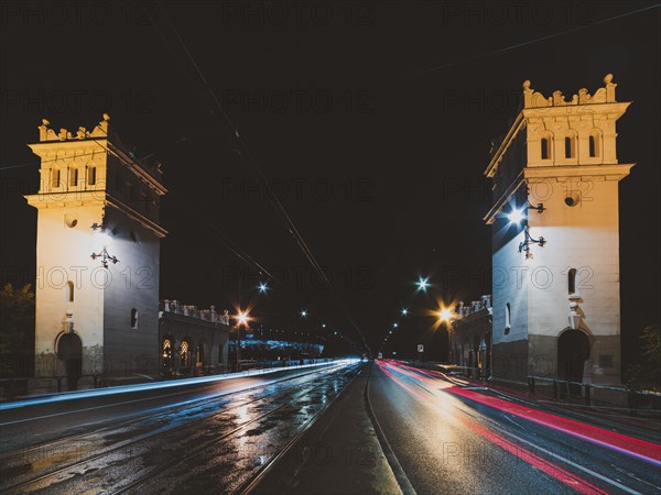 City bridge at night with light trails