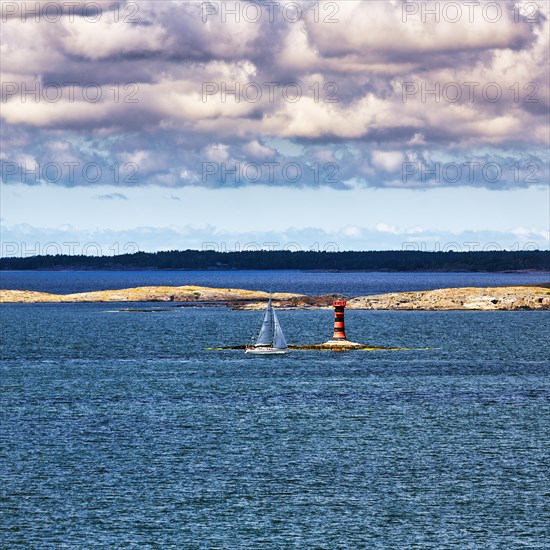 Marhaellan lighthouse in the archipelago, sailing boat, Mariehamn harbour entrance, Aland Islands, Gulf of Bothnia, Baltic Sea, Finland, Europe