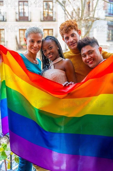 Portrait of couples of gay guys and lesbian girls in a portrait with rainbow flag, lgtb concept