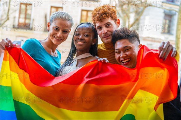 Couples of gay guys and girls lesbian in a portrait with rainbow flag, lgtb concept