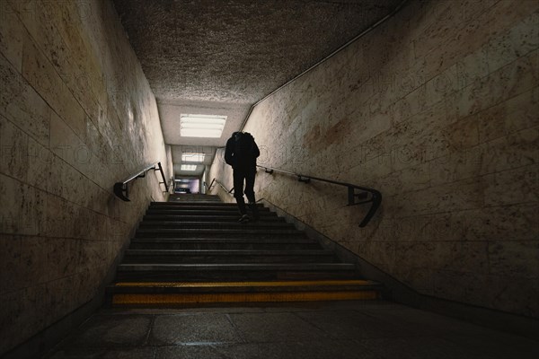 Silhouette of the man in underground tunnel