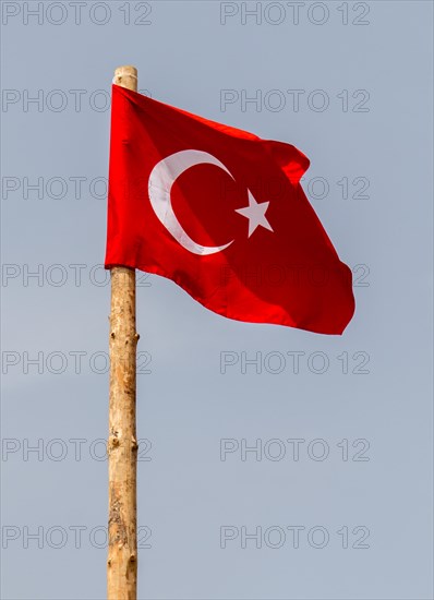 Turkish national flag hang on a pole in open air
