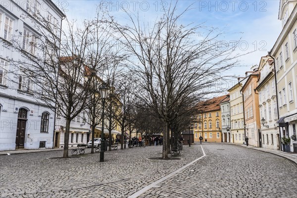 Prague, Czech Republic, February 23, 2023: Na Kampe Square is located at the base of the Charles Bridge on the castle side of the river at Kampa Island. This scenic square is bordered with historical dwelling houses.=, Europe
