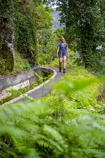 Hiker on Levada do Moinho, Ponta do Sol, Madeira, Portugal, Europe