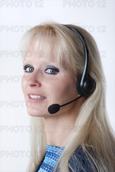 Portrait of young woman with headset