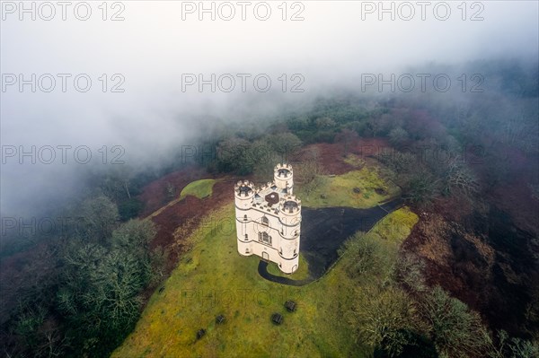 Misty morning over Haldon Belvedere from a drone, Lawrence Castle, Higher Ashton, Exeter, Devon, England, United Kingdom, Europe