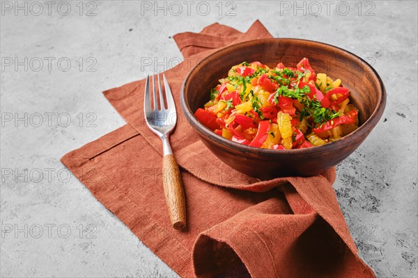 Clay bowl with vegetable ragout on a napkin