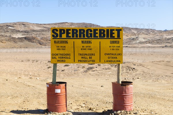 Warning sign at the diamond exclusion zone in the Sperrgebiet National Park, also Tsau ÇKhaeb National Park, Namibia, Africa