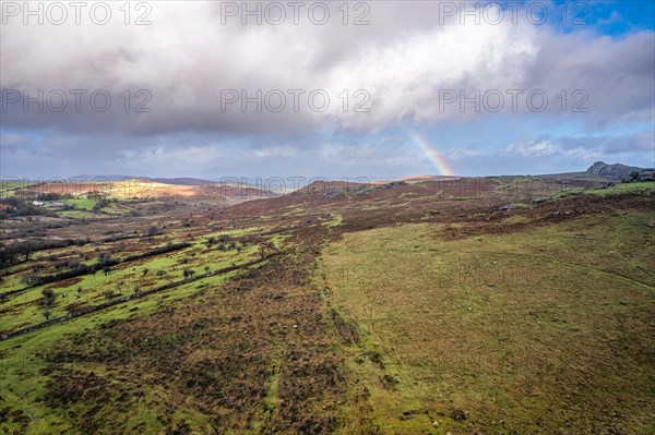 Rainbow over Emsworthy Mire from a drone, Haytor Rocks, Dartmoor National Park, Devon, England, UK
