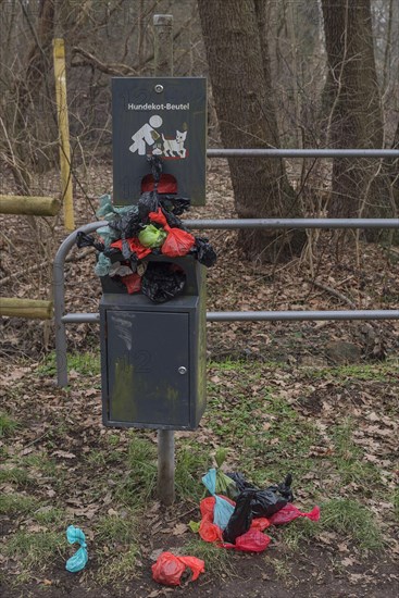 Overcrowded collection point for dog excrement bags in the meadow meadows of the Pegnitz, Bavaria, Germany, Europe