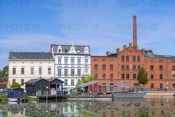 Boathouses, residential buildings and industrial architecture on Muehlendamm, Brandenburg an der Havel, Brandenburg, Germany, Europe