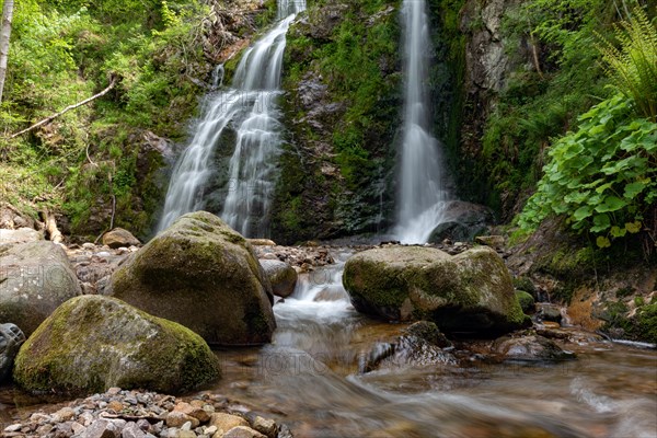 Waterfall falling over Mossy Rocks in the Vosges Mountains. Alsace, France, Europe