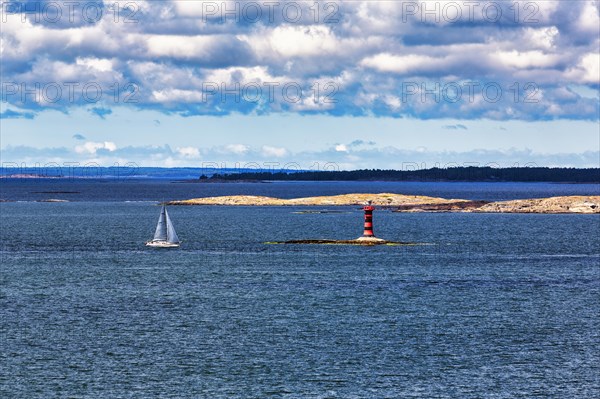 Marhaellan lighthouse in the archipelago, sailing boat, Mariehamn harbour entrance, Aland Islands, Gulf of Bothnia, Baltic Sea, Finland, Europe