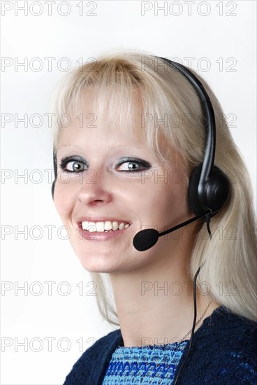 Portrait of young woman with headset