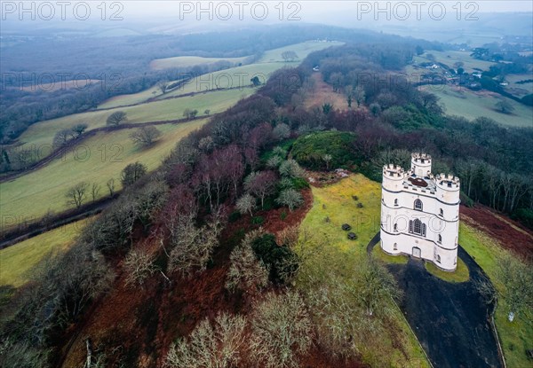 Misty morning over Haldon Belvedere from a drone, Lawrence Castle, Higher Ashton, Exeter, Devon, England, United Kingdom, Europe