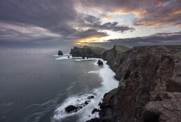 Red cliffs and rocks in the sea, coastal landscape, long exposure at sunset, Miradouro do Canical, Ponta de Sao Lourenco, volcanic peninsula Sao Lourenco, Ponta de San Lorenzo, Madeira, Portugal, Europe