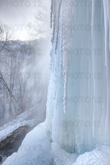 Icicles at the waterfall, permafrost with icy landscape, Swabian Alb, Bad Urach, Baden-Wuerttemberg, Germany, Europe