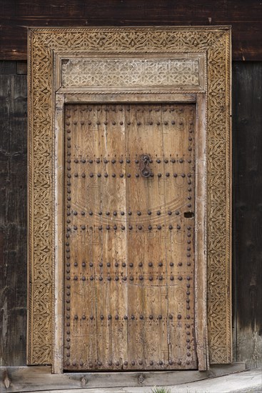 Hand-carved entrance door to a carpenter's workshop, Bad Hindelang, Allgaeu, Bavaria, Germany, Europe