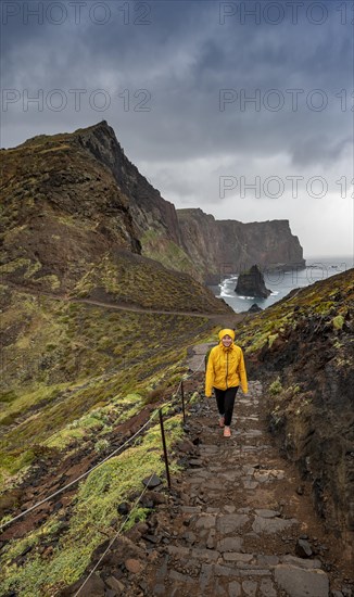 Hiker, coastal landscape, cliffs and sea, rugged coast with rock formations, Cape Ponta de Sao Lourenco, Madeira, Portugal, Europe