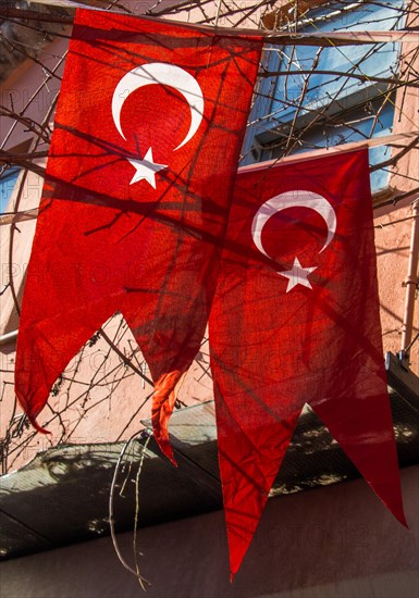 Turkish national flag hanging in the street in open air