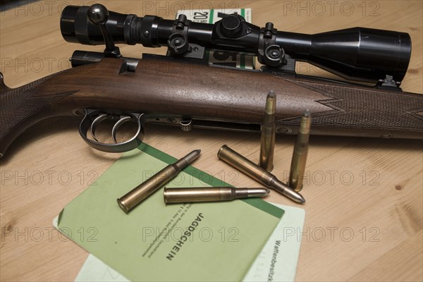 Decorated hunting weapons with ammunition, hunting license and gun ownership card and, Hesse, Germany, Europe