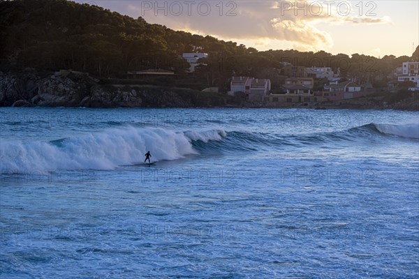 Silhouette of a surfer on the Costa Brava in the province of Gerona in Catalonia Spain