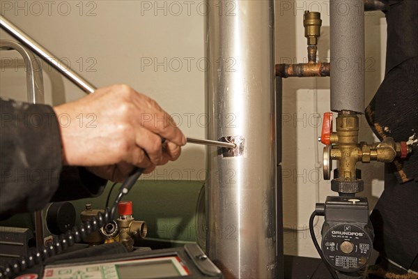 Chimney sweep, measuring rod, flue gas pipe, flue gas inspection, gas boiler
