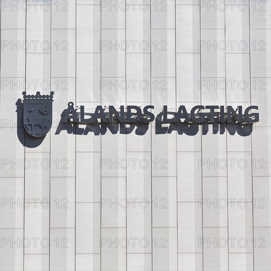 Lettering with coat of arms on facade, Aland Parliament, Mariehamn, Aland Islands, Aland Islands, Finland, Europe