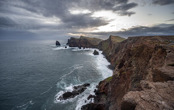 Red cliffs and rocks in the sea, coastal landscape, at sunset, Miradouro do Canical, Ponta de Sao Lourenco, volcanic peninsula of Sao Lourenco, Ponta de San Lorenzo, Madeira, Portugal, Europe