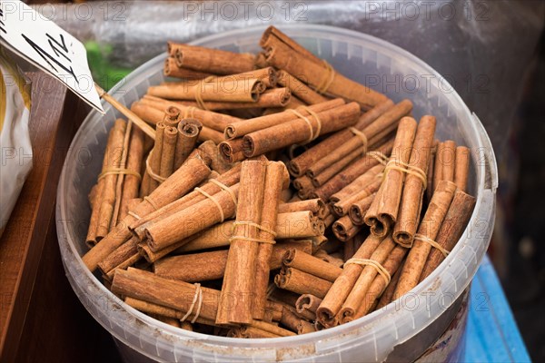 Bunches of cinnamon sticks in the herbal shop