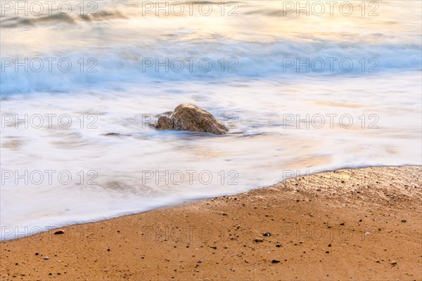 Wave crash on a sandy beach in the Atlantic Ocean. Sables dOlonne, Vendee, Pays-de-la-Loire, France, Europe