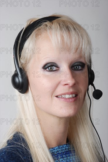 Portrait of young woman with headset