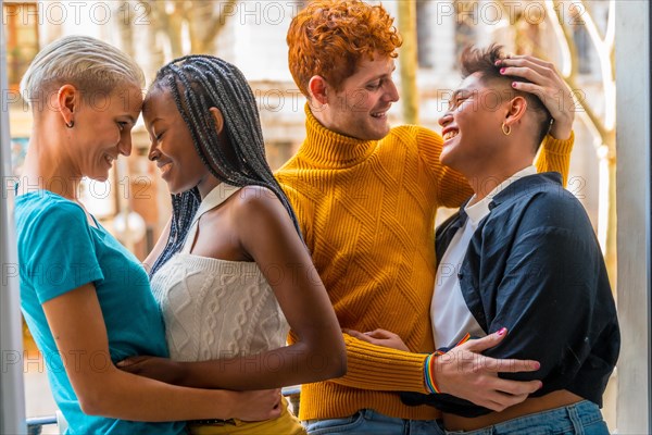 Portrait of couples of gay guys and lesbian girls hugging together, lgtb concept