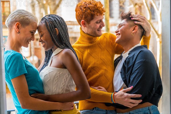 Portrait of couples of gay guys and lesbian girls hugging together, lgtb concept
