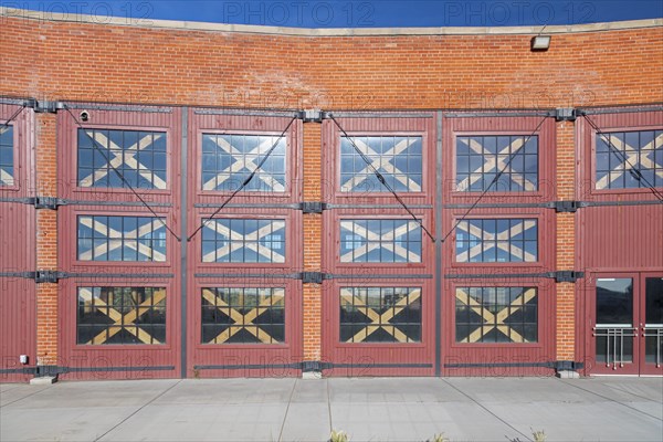 Evanston, Wyoming, The historic roundhouse and railyards, built by the Union Pacific Railroad in 1912. The building had 28 bays for railcar and locomotive repair, with curved walls 30 feet high. UPRR closed the facility in 1971. It is now owned by the city of Evanston and has been partially renovated