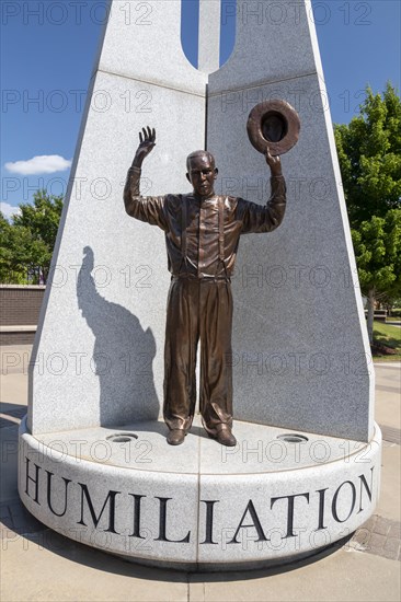 Tulsa, Oklahoma, Hope Plaza at John Hope Franklin Reconciliation Park. The park is a memorial based on the 1921 race massacre in which many African-Americans were murdered and the Greenwood District burned to the ground. The plazas sculpture includes three figures from the race massacre representing Humiliation, Hostility, and Hope