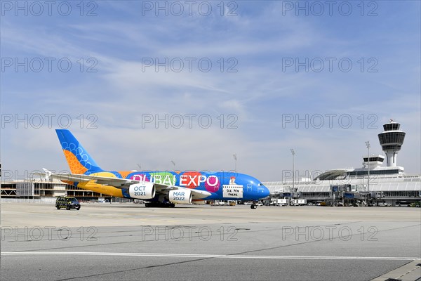 Rolling Emirates Airlines special livery Expo Dubai 2021-2022 Airbus A380-800 in front of Terminal 1 with Tower, Munich Airport, Upper Bavaria, Bavaria, Germany, Europe