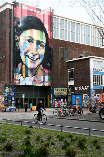 Anne Frank portrait on the facade of the Straat Museum, NDSM Plein, Amsterdam, Netherlands