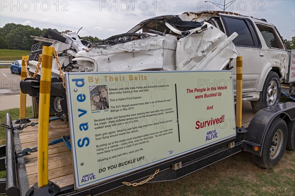 Conway, Missouri, An auto safety display at a rest area on Interstate 44 promotes the use of seat belts. Two cars that crashed are shown: the passengers in one car who wore seat belts survived, the unbelted driver of the other car died