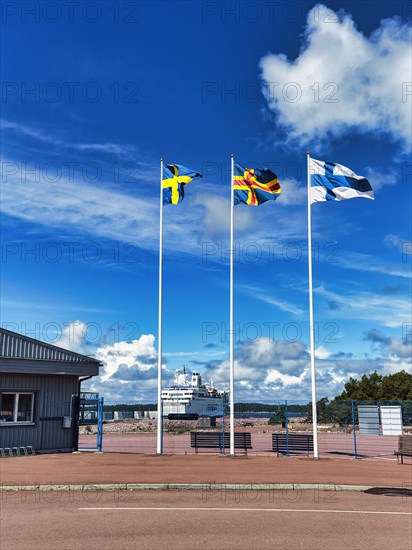 Three flags side by side, Sweden, Aland, Finland, sunny weather, Eckeroe ferry terminal, Fasta Aland, Aland Islands, Aland Islands, Finland, Europe