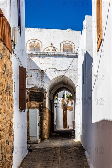 Captains house in the winding streets with white houses, Lindos, Rhodes, Greece, Europe