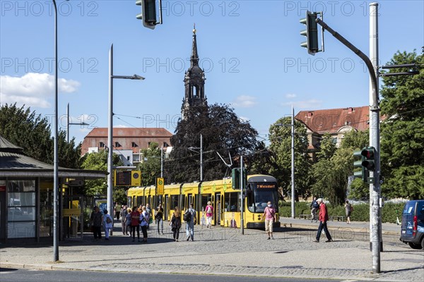 Pedestrian traffic lights at Albertplatz in Dresden during rush hour, in the background the Dreikoenigskirche, Dresden, Saxony, Germany, Europe