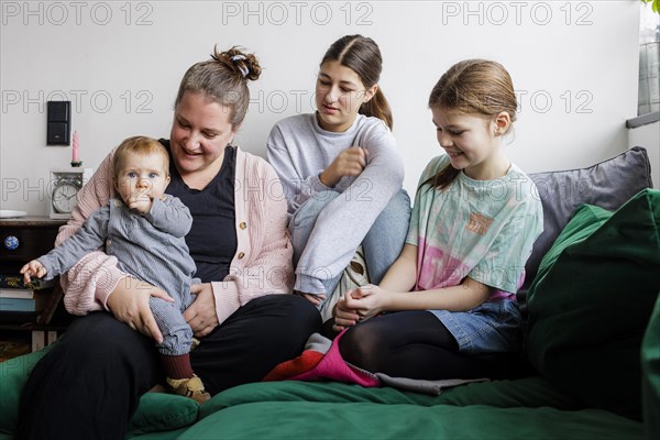 Woman with three daughters, Bonn, Germany, Europe