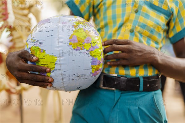 Theme: School children in Africa with an inflatable globe, Krokrobite, Ghana, Africa